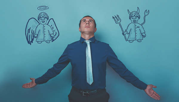 Person with an angel over one shoulder and a devil over the other shoulder