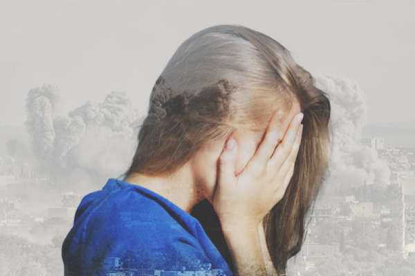 Woman covering her eyes and face with her hands